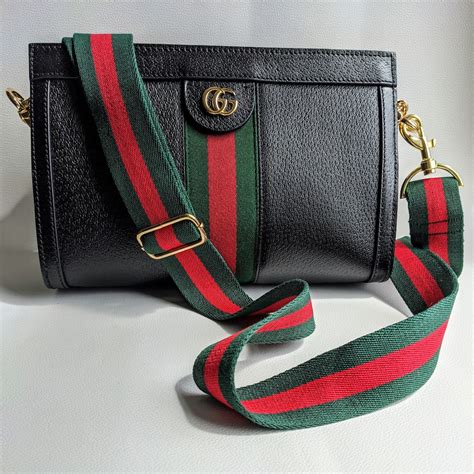 white bone spur gucci shoulder bag with stripe crossbody strap|Gucci crossbody purses.